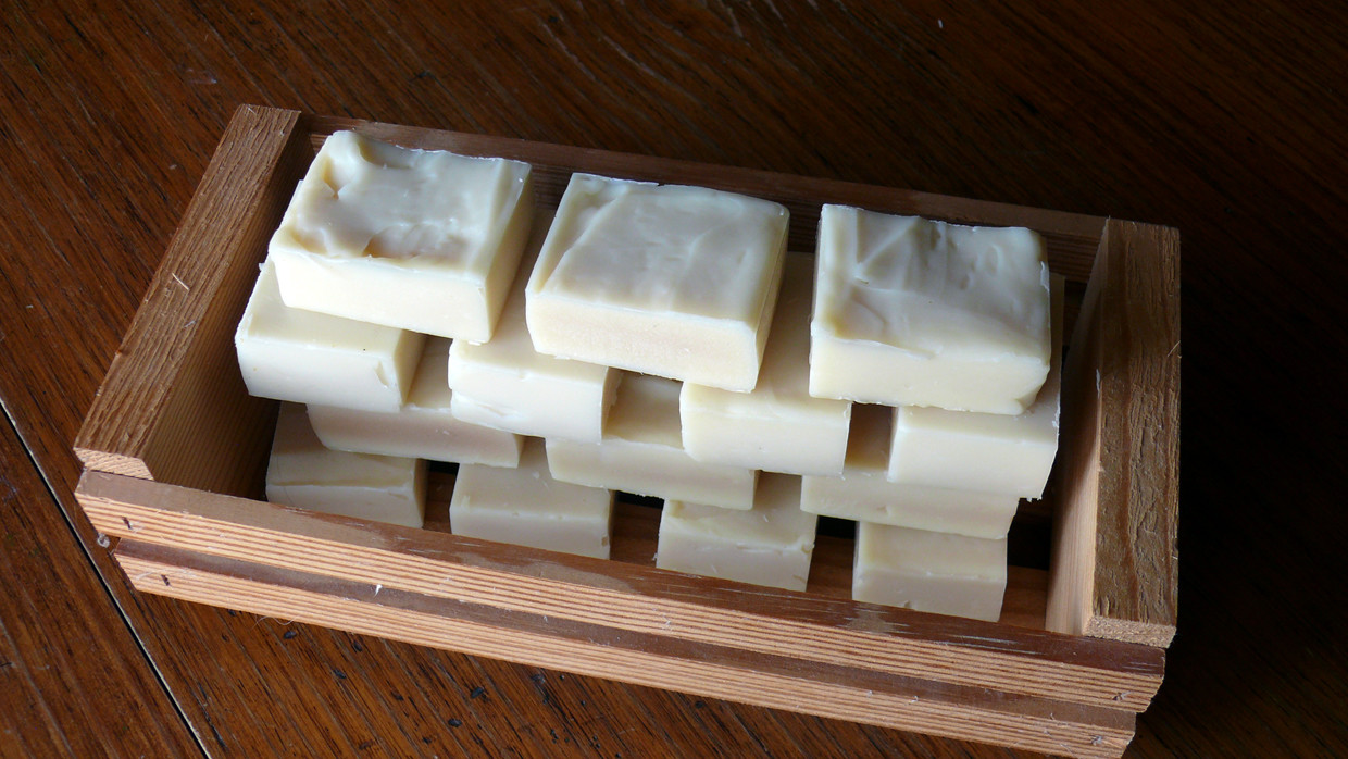 Castile soap half-bars curing in open cedar box.